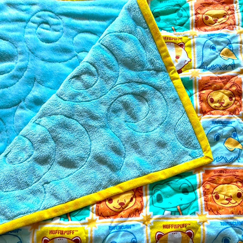 Handmade flannel top and premium cozy fleece baby Harry Potter houses quilt.